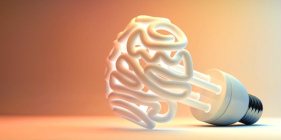 An illuminated fluorescent light bulb in the shape of a stylized brain on an isolated colorful studio background